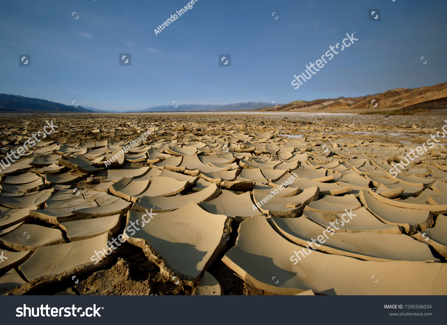 Cracked desert earth with crust of salt, Death Valley National Park, Nevada, U #1590336034