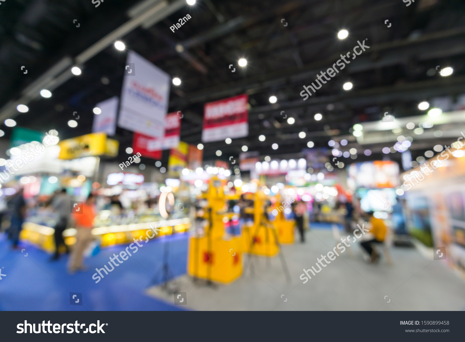 Abstract blur people in exhibition hall event trade show expo background. Large international exhibition, convention center, Business marketing and MICE industry concept. #1590899458