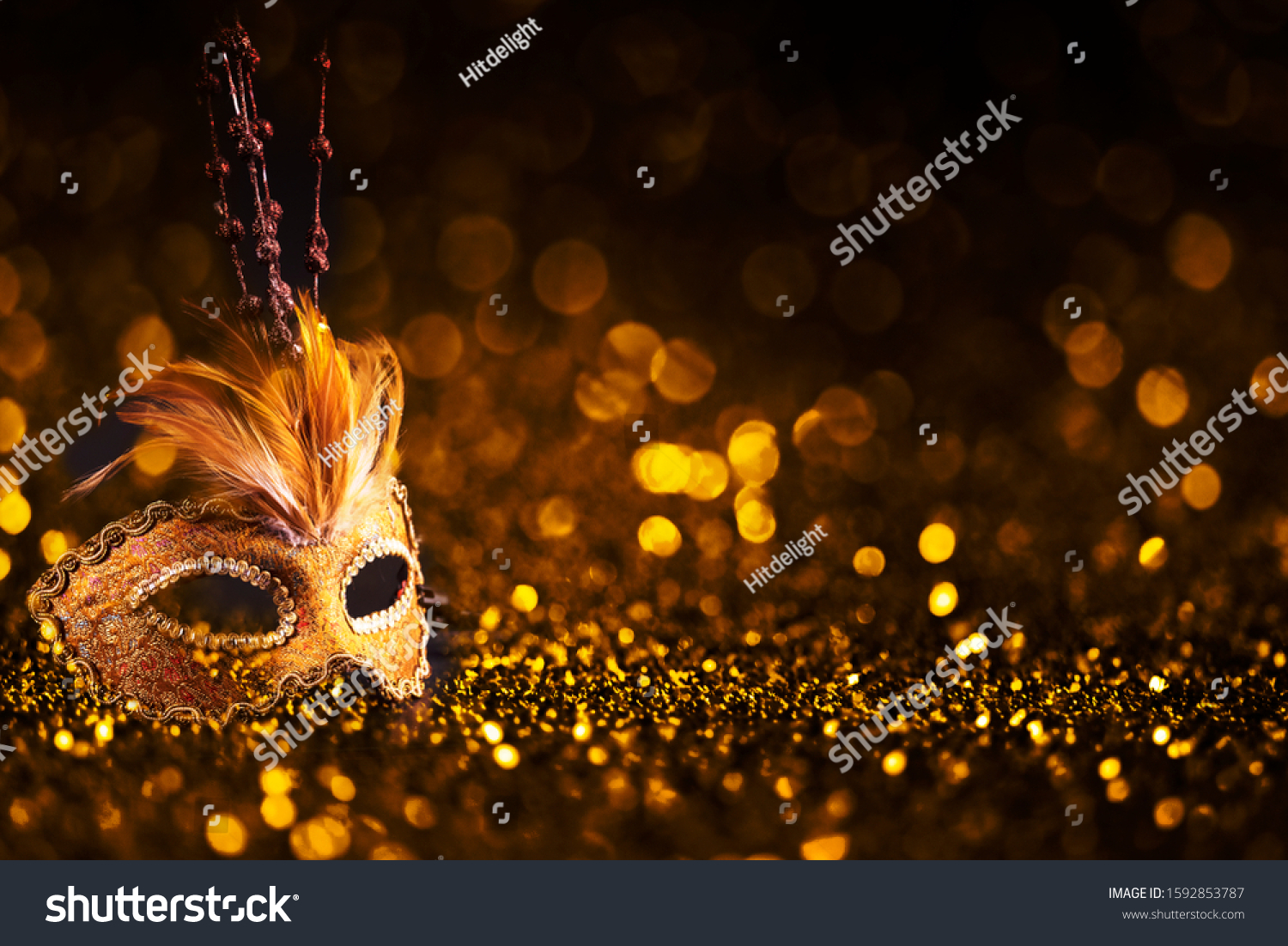 Luxury venetian mask on dark godlen bokeh background. New year and christmas party celebration design banner. Carnival masquerade fantasy costume ball. #1592853787