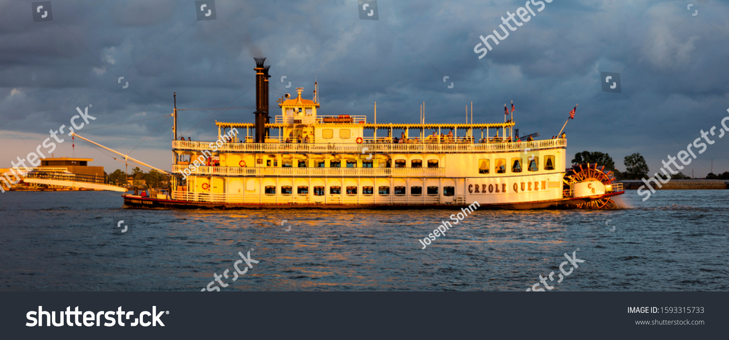 APRIL 24, 2019, NEW ORLEANS, LA, USA - Natchez Riverboat on Mississippi River in New Orleans, Louisiana at sunset #1593315733