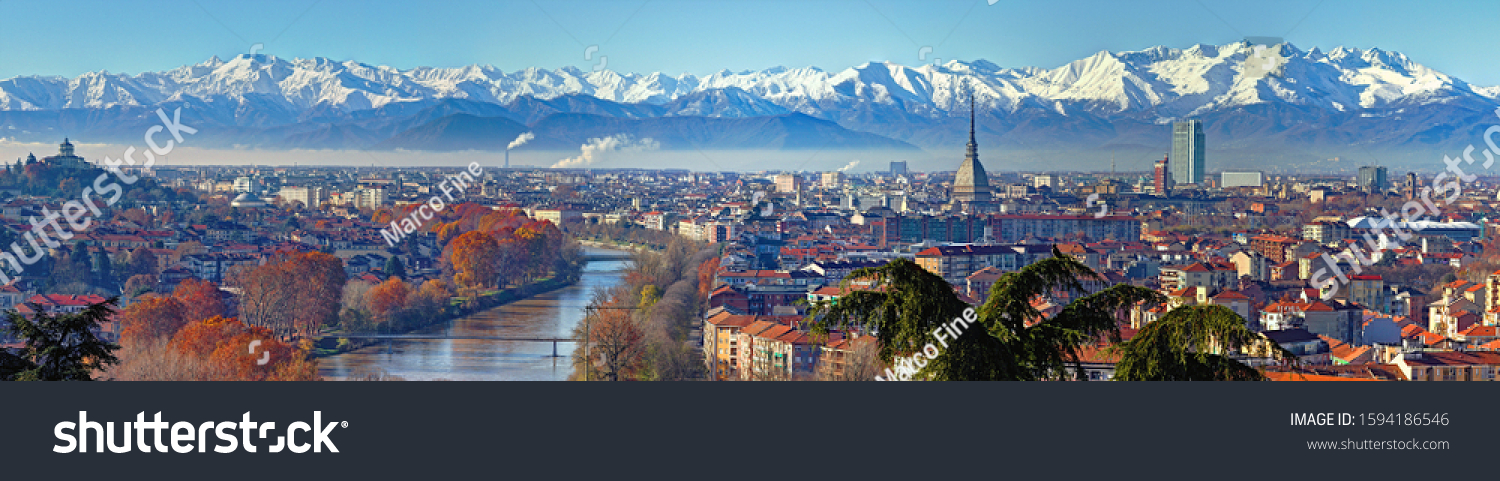 Panoramic view on Turin skyline, with the city center, Po river and Mole Antonelliana, in a clear winter morning with snowy alps on background #1594186546