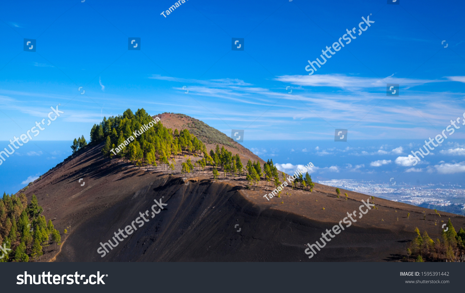 Gran Canaria, December, dark volcanic ash moutain Montanon Negro, ie Black Mountain, Las Palmas in far distance #1595391442