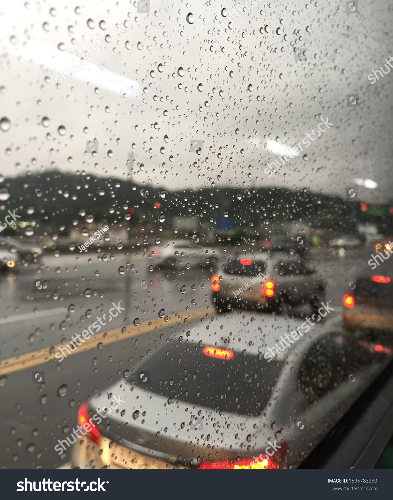 Rainy day scenery in the bus #1595783230