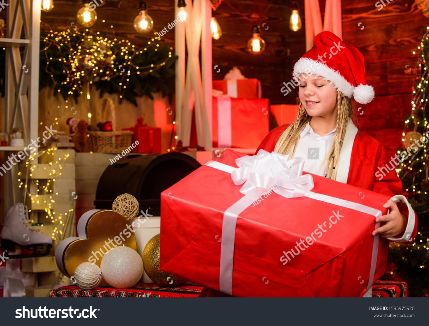 magical joy. kid with present box. winter shopping sale. cheerful little girl at christmas tree. decorate home with joy. xmas mood. family holiday celebration. happy new year. child in red santa hat. #1595975920