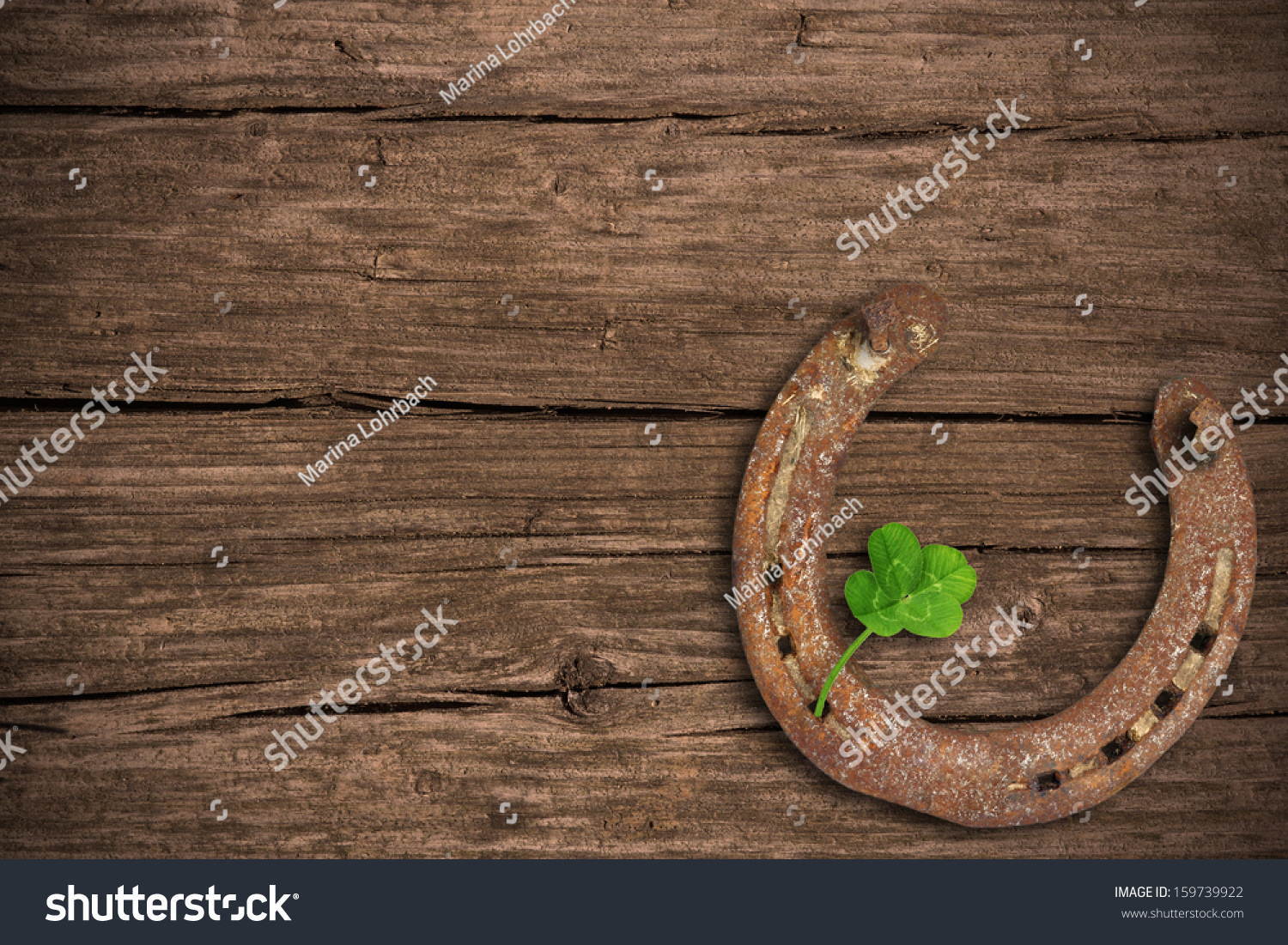 Blackboard with four-leaved clover and a horse shoe #159739922