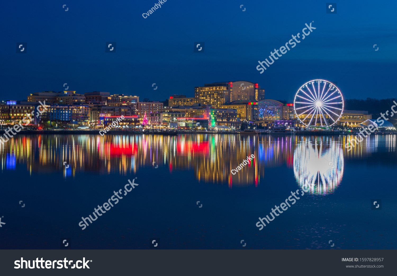 Skyline of the National Harbor illuminated waterfront, a tourist attraction on the banks of the historic Potomac River in Prince Georges County Maryland.