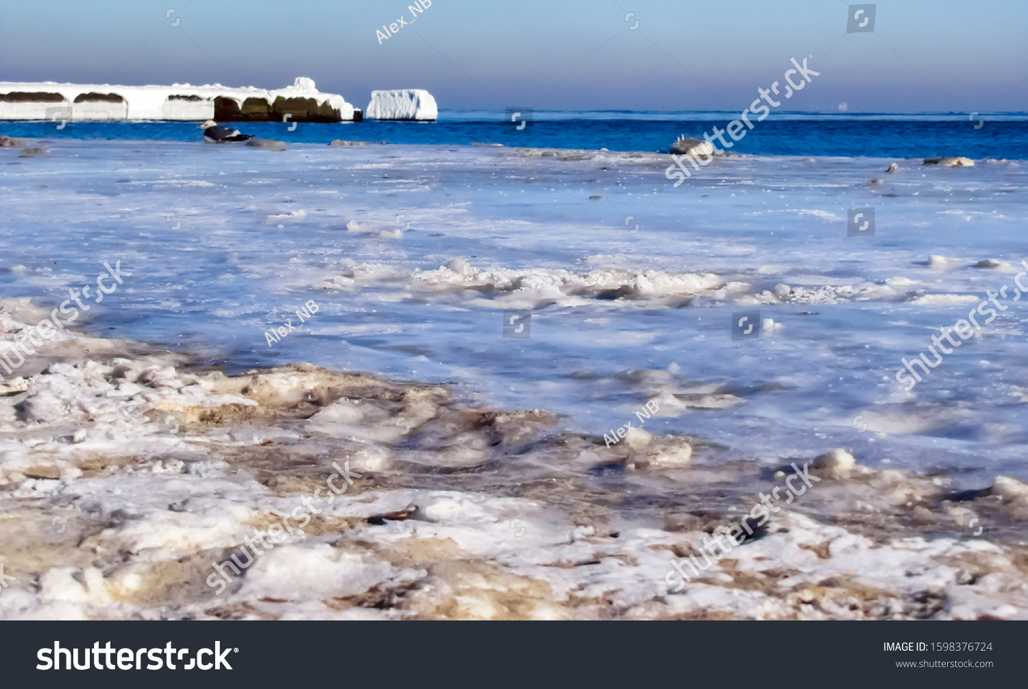 Background of the frozen sea coast.                         #1598376724