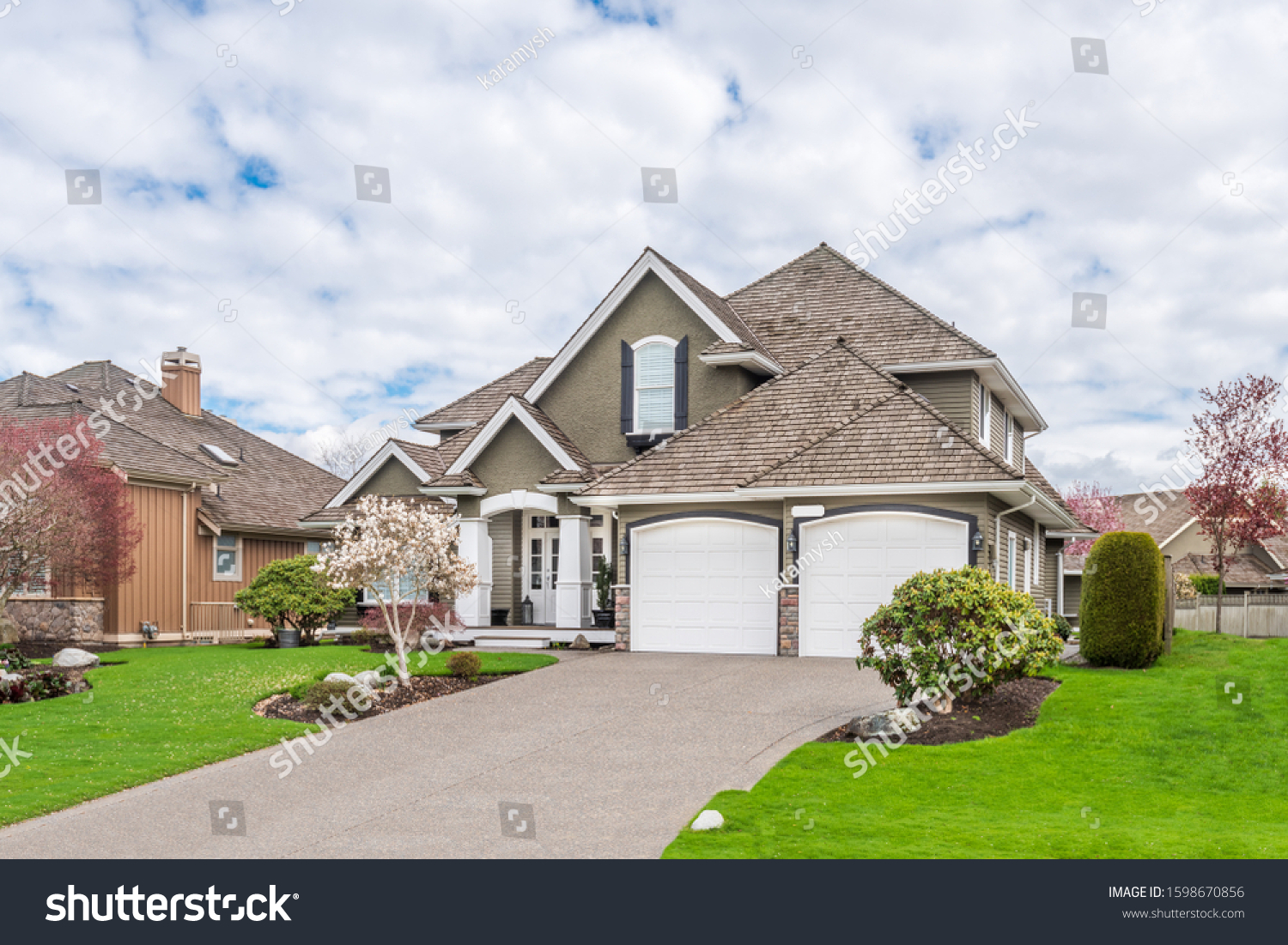 A perfect neighbourhood. Houses in suburb at Summer in the north America. Luxury houses with nice landscape. #1598670856