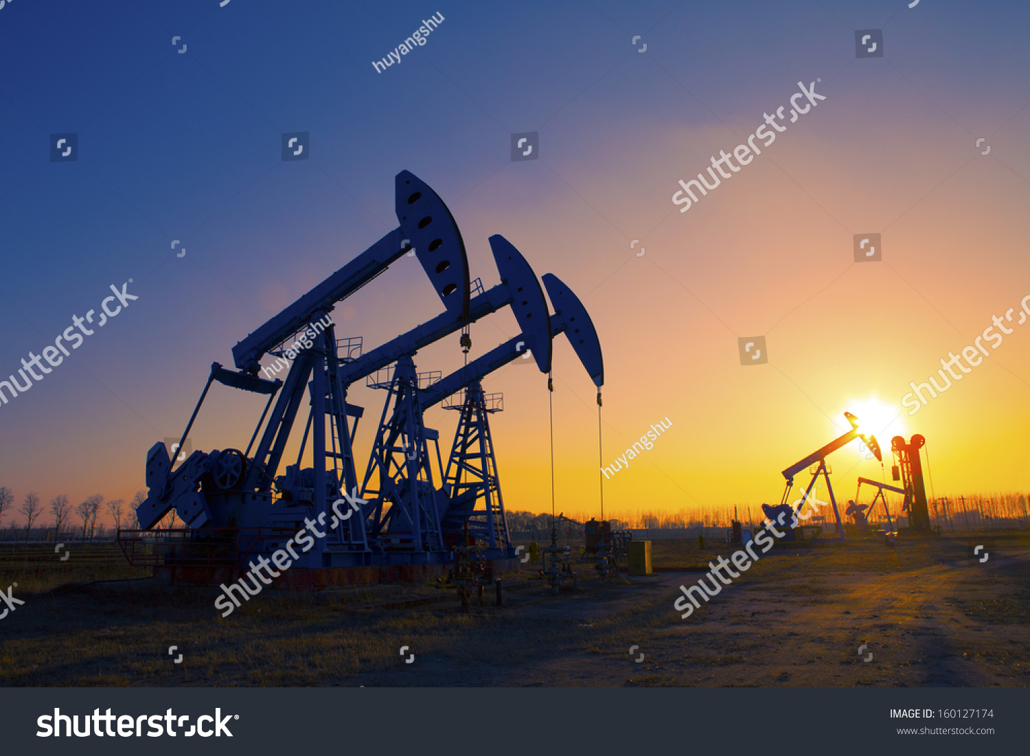 Oil pump oil rig in the sunset background for design #160127174