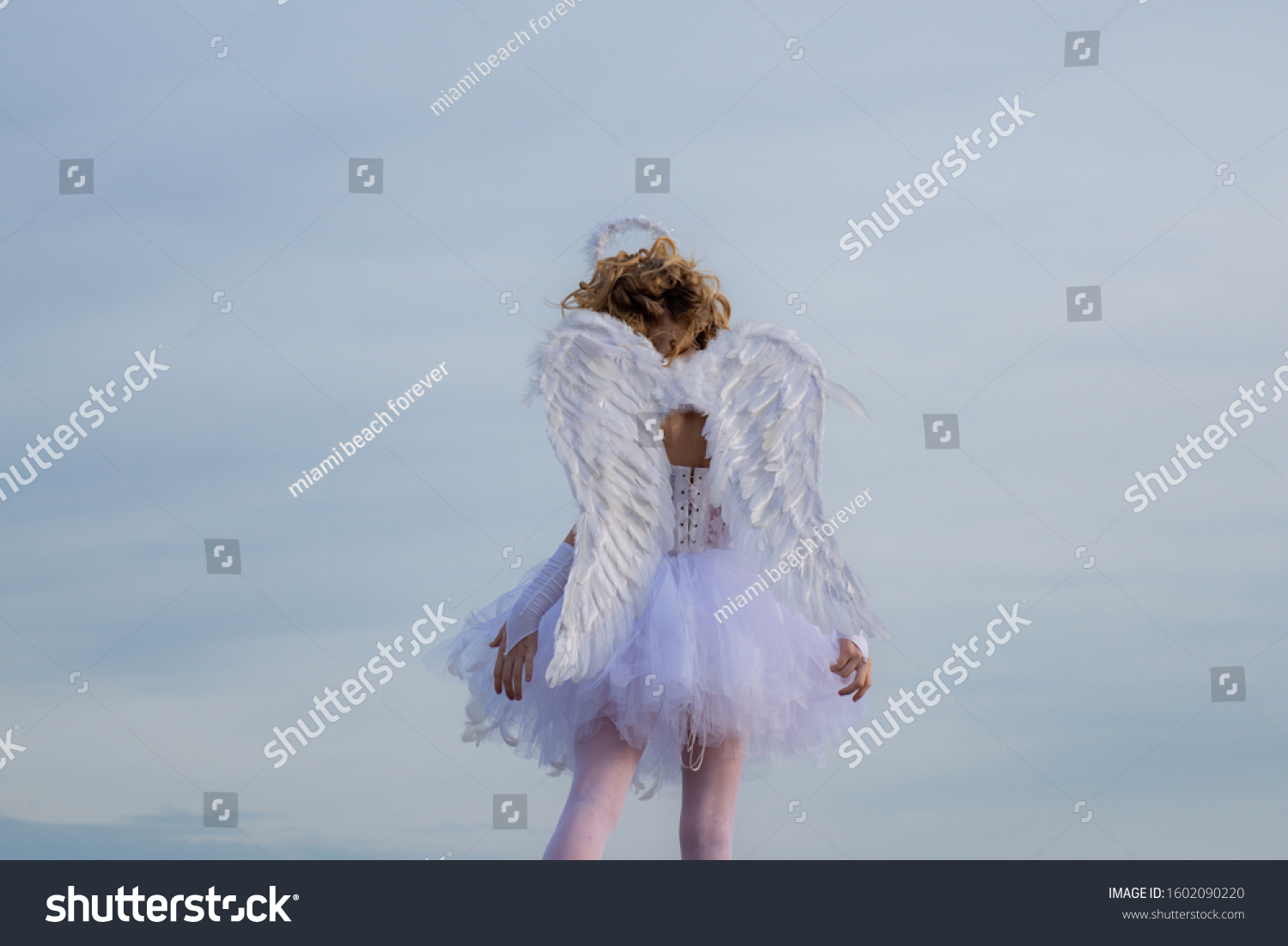 Innocent girl. Enjoying magic moment. Valentines day card. Cute teen cupid on the cloud - sky background #1602090220