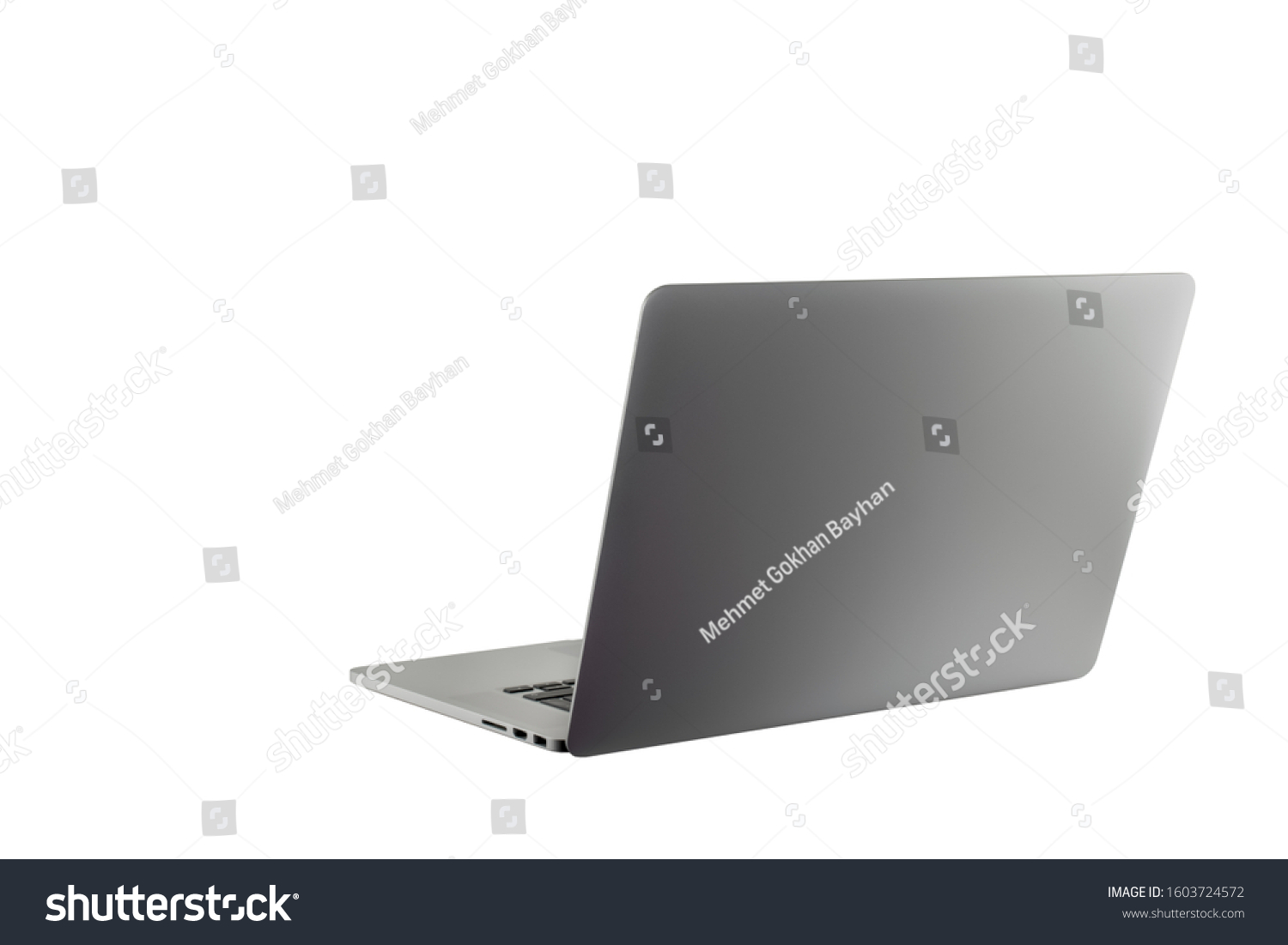 Open laptop notebook isolated on white background. Thin, modern looking. Copy space for text or image. Metallic silver color. Work from home or work from anywhere concept. #1603724572
