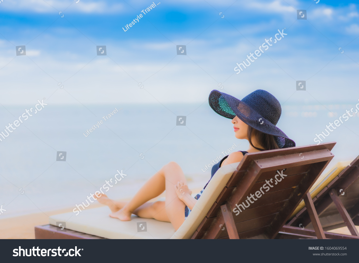 Portrait beautiful young asian women relax smile happy around sea beach ocean for vacation travel in holiday #1604069554