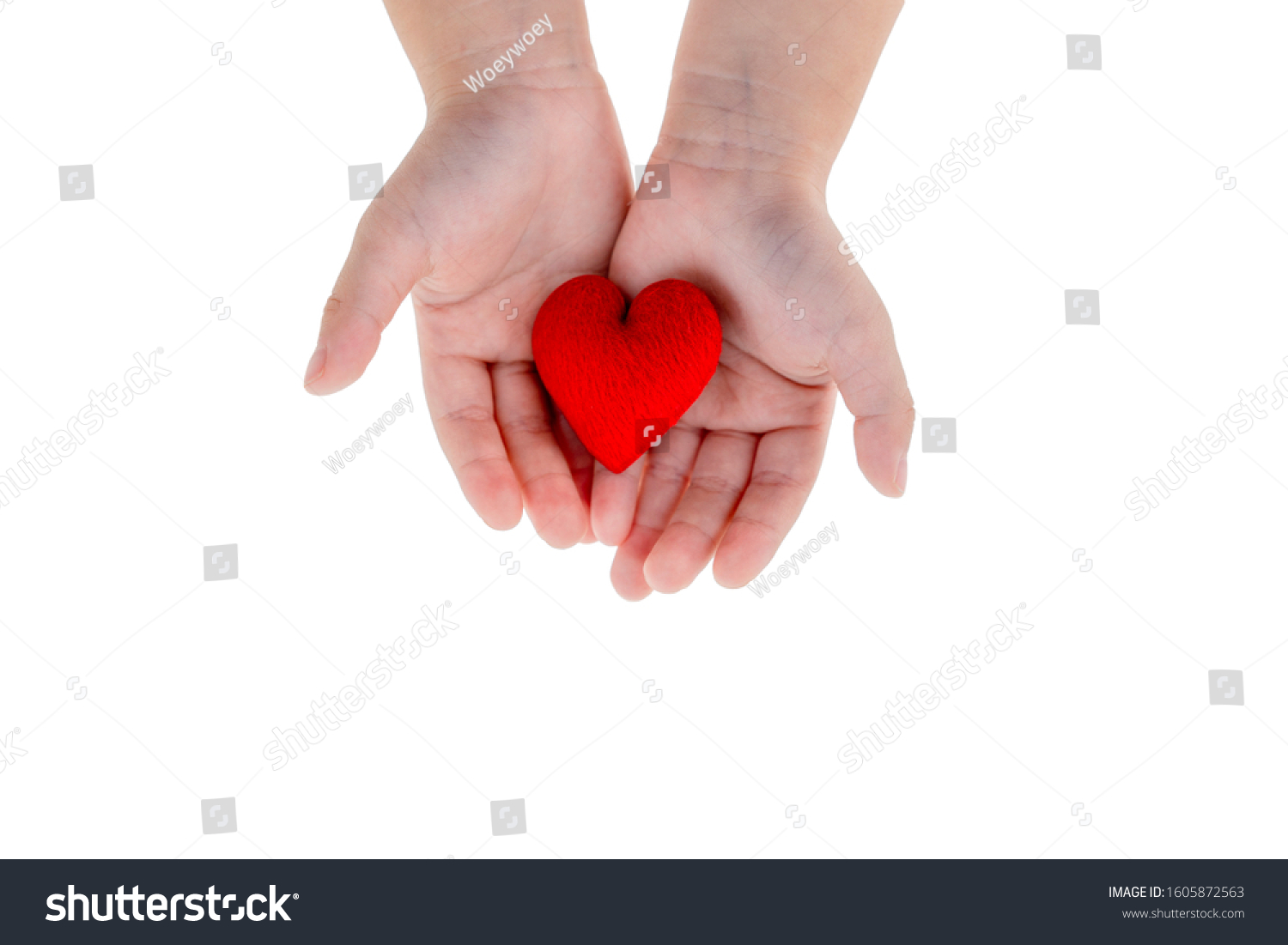 Love and Medical Cocept: two hans of a good health kid holding red heart with white backgorund and clipping path #1605872563