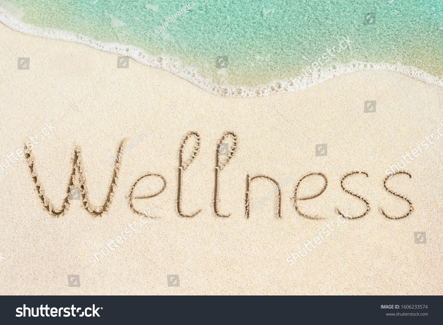 Wellness concept photo. Word Wellness handwritten on the sand. Beach and soft wave background. #1606233574