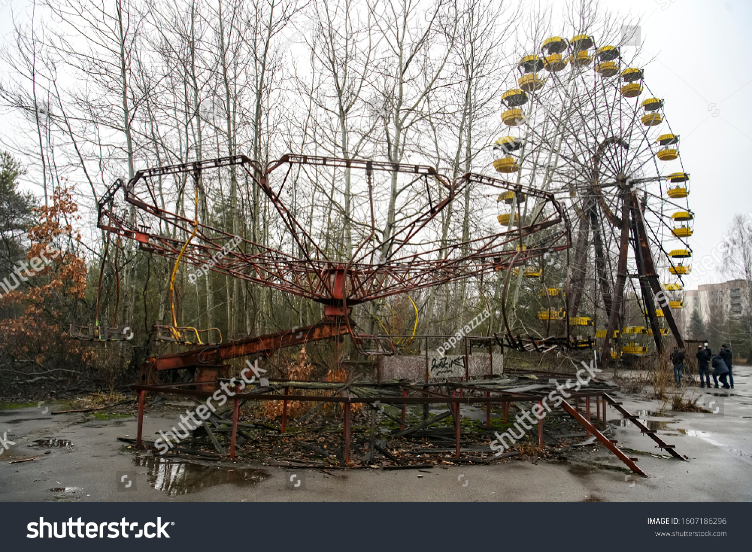 Abandoned amusement park in ghost town Prypiat. Overgrown trees and collapsing buildings in Priryat, Chornobyl exclusion zone. December 2019
 #1607186296