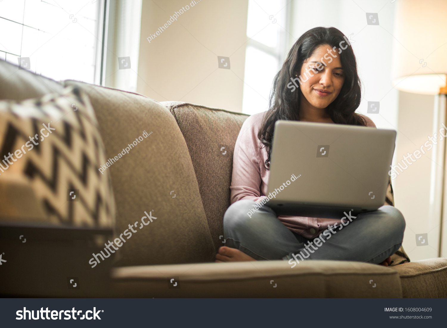 Hispanic woman working on the computer #1608004609