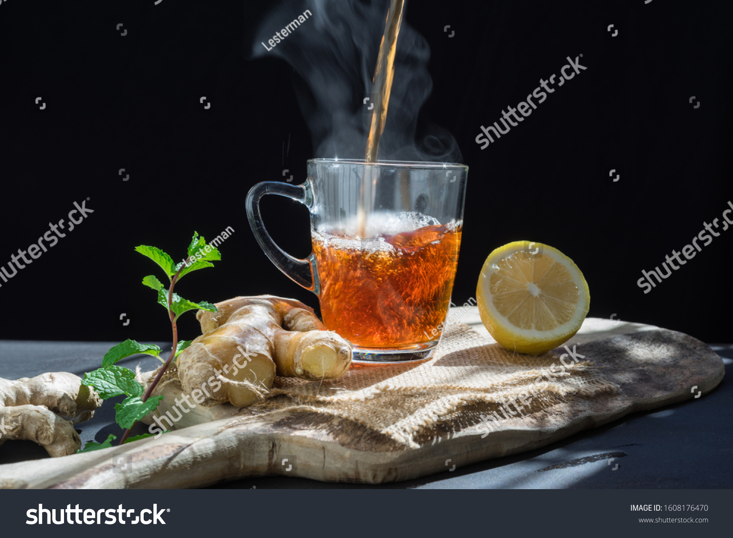 health, traditional medicine and ethnoscience concept.ginger tea on rustic background #1608176470