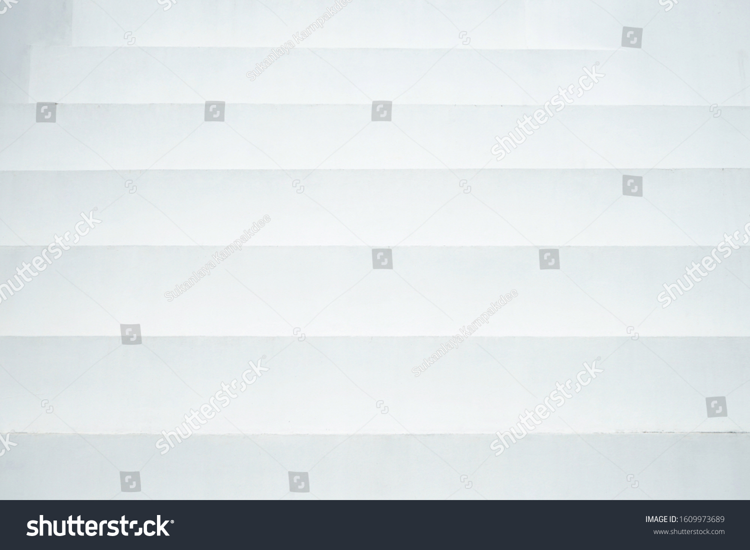 Closeup interior abstract white cement steps or stairs for texture or background #1609973689