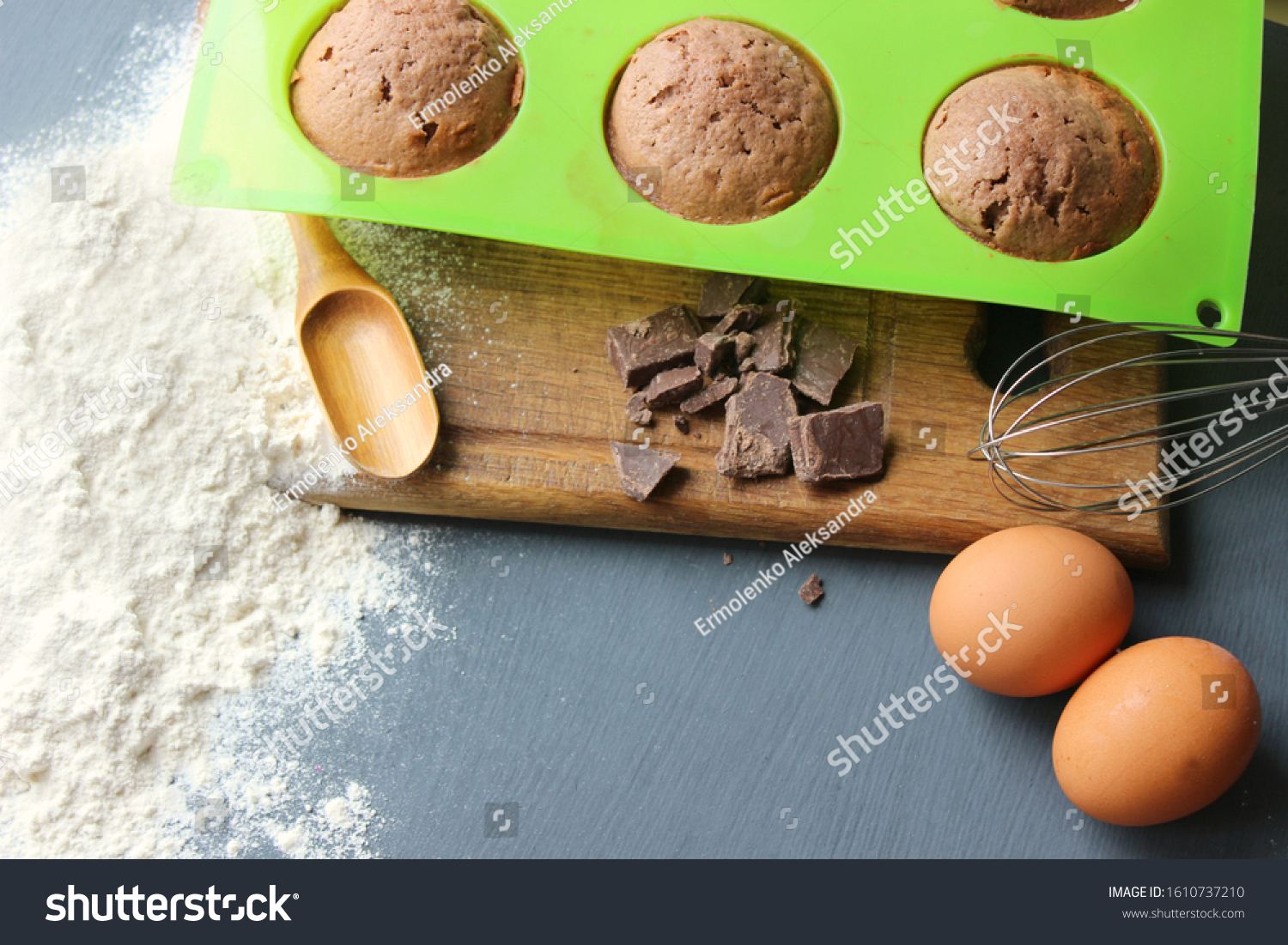 Homemade muffins with chocolate. Ingredients for baking. Copy space. Baking ingredients for chocolate brownies. #1610737210