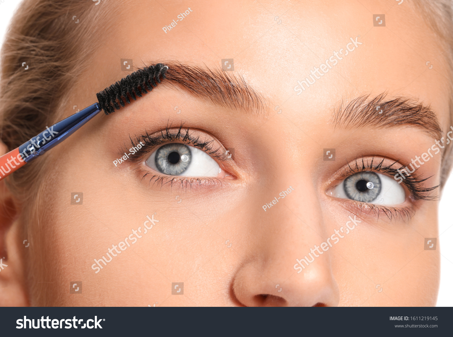 Young woman undergoing eyebrow correction procedure, closeup #1611219145