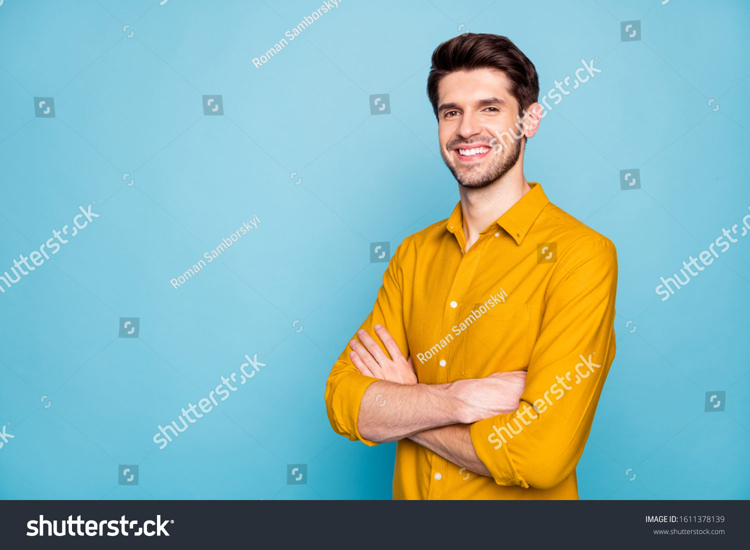 Profile side view portrait of his he nice attractive content cheerful cheery brown-haired guy folded arms isolated over bright vivid shine vibrant blue green turquoise color background #1611378139