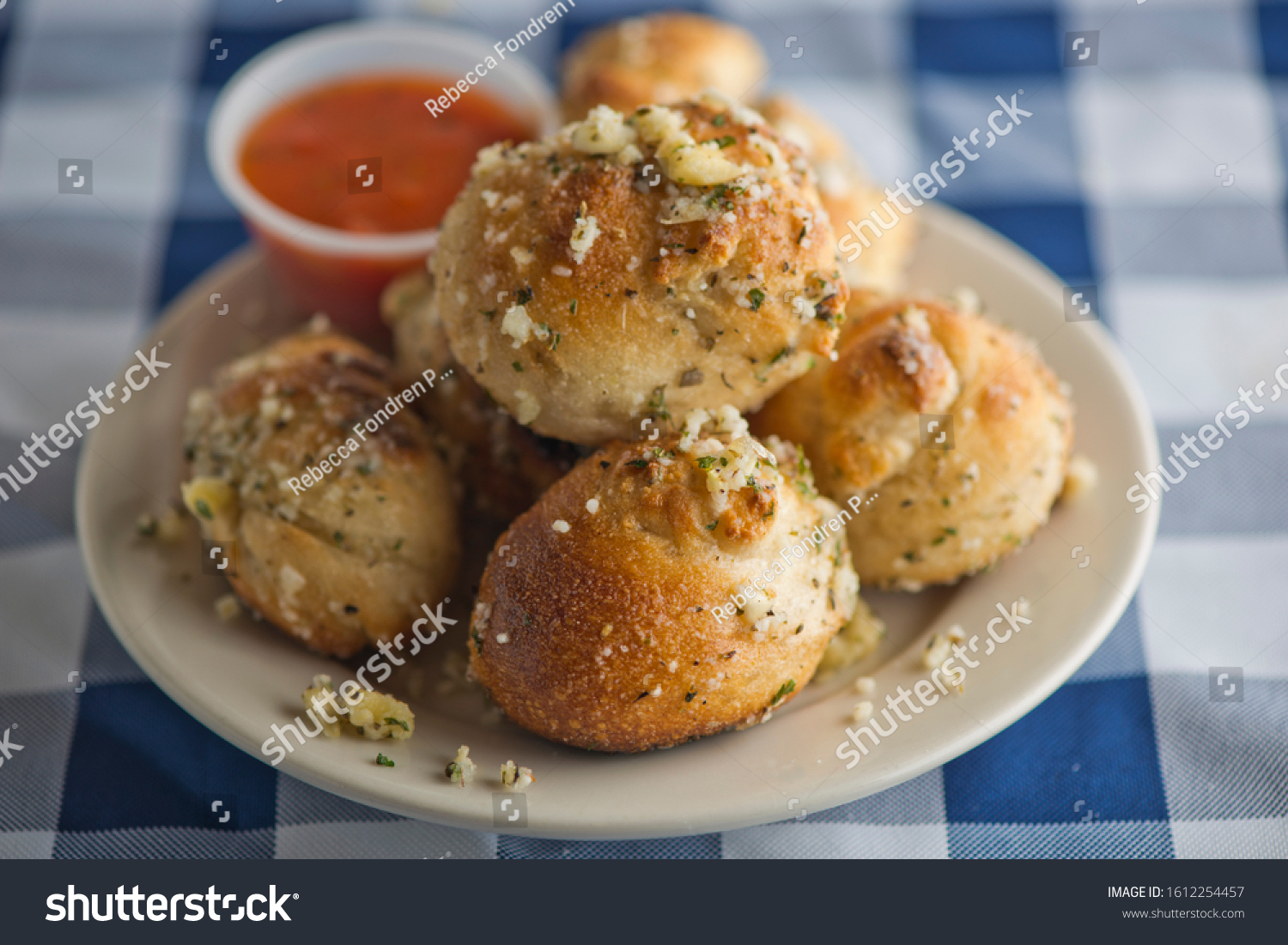 Garlic Herb and Cheese Rolls or Knots. Parmesan pull apart rolls, made with homemade pizza dough mixed with garlic and spices, rolled into knots baked and seasoned with garlic and olive oil.  #1612254457