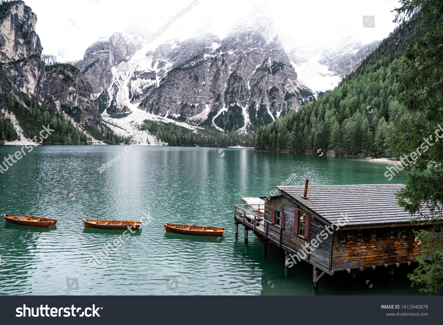 Beautiful Lago di Braies in South Tyrol, Italy with it's famous wooden boats an turquoise water #1612940878