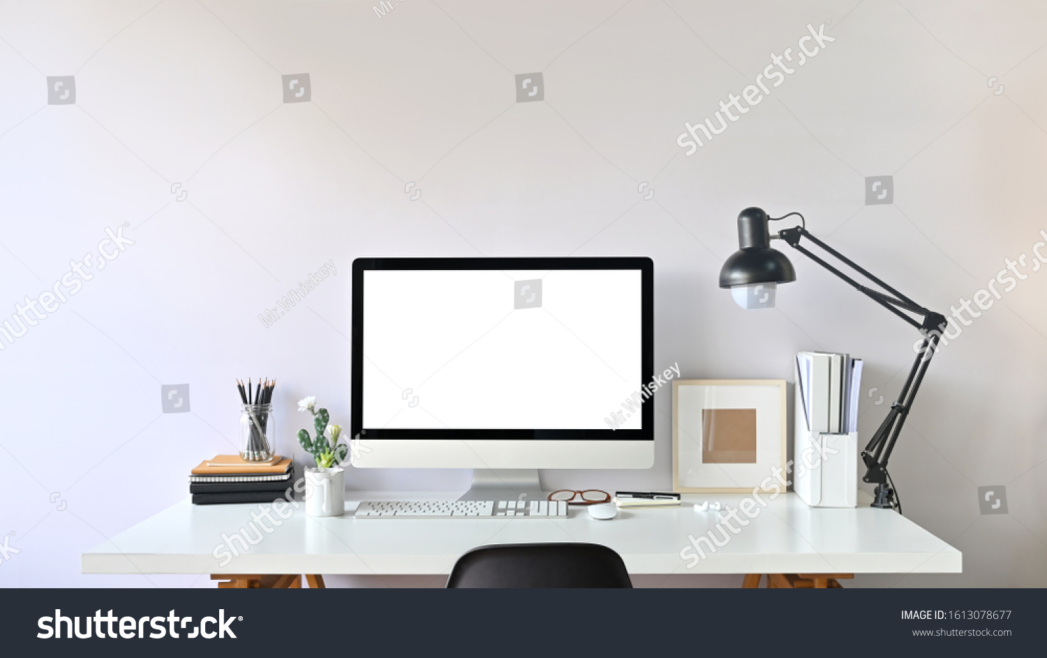 Photo of Contemporary Workspace.
White blank screen monitor on modern working desk. Equipment on table. Modern office concept.  #1613078677