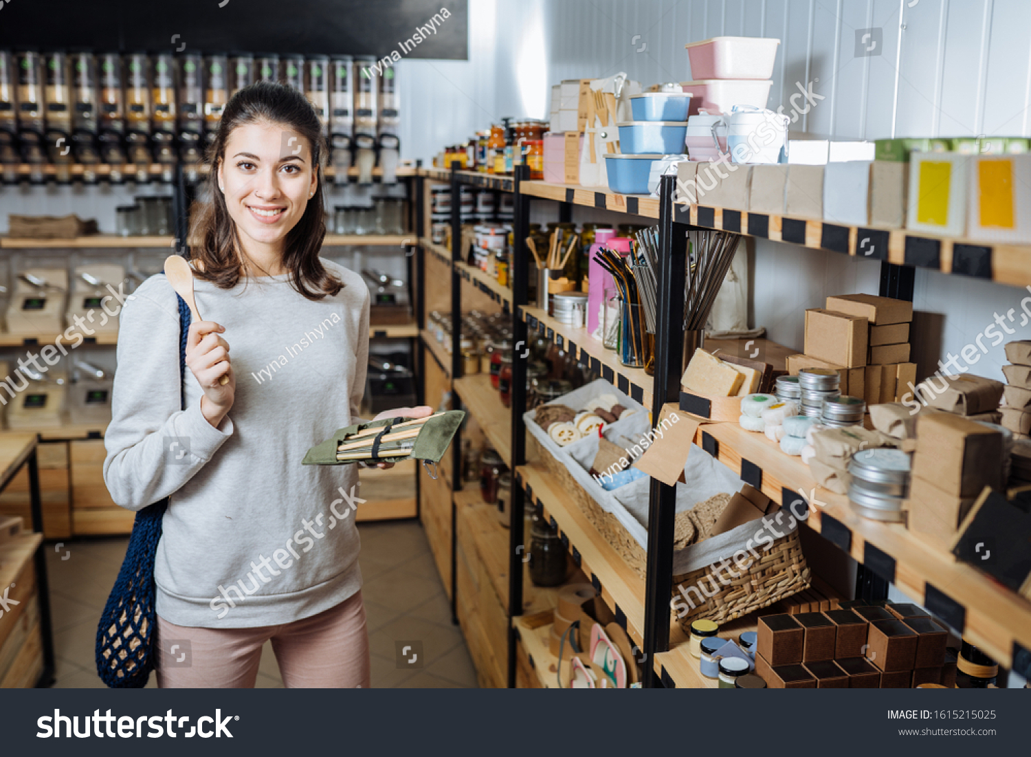 Eco friendly vegan woman customer chooses and buys products in zero waste shop. Eco shopping at local business concept. Plastic free items. reuse, reduce #1615215025