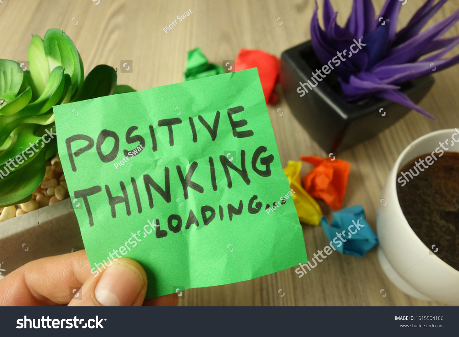 Slogan positive thinking loading handwritten on sticky note, success and motivation concept #1615504186