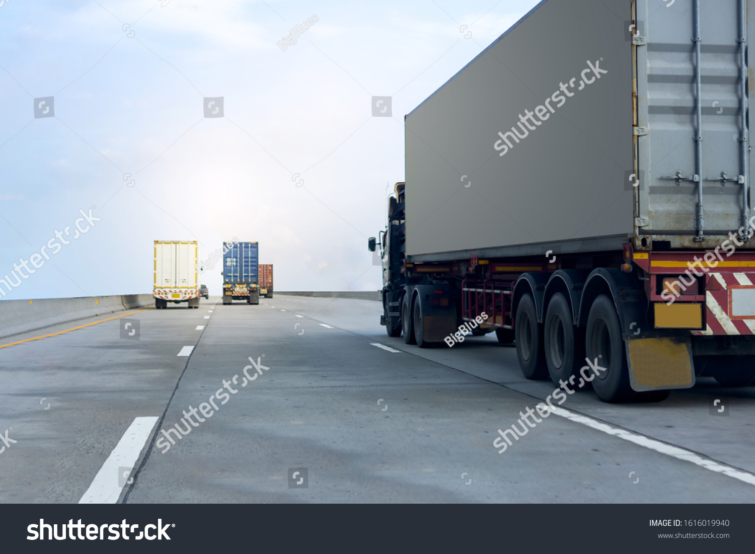 Truck on highway road with container, transportation concept.,import,export logistic industrial Transporting Land transport on the asphalt expressway against blue sky #1616019940