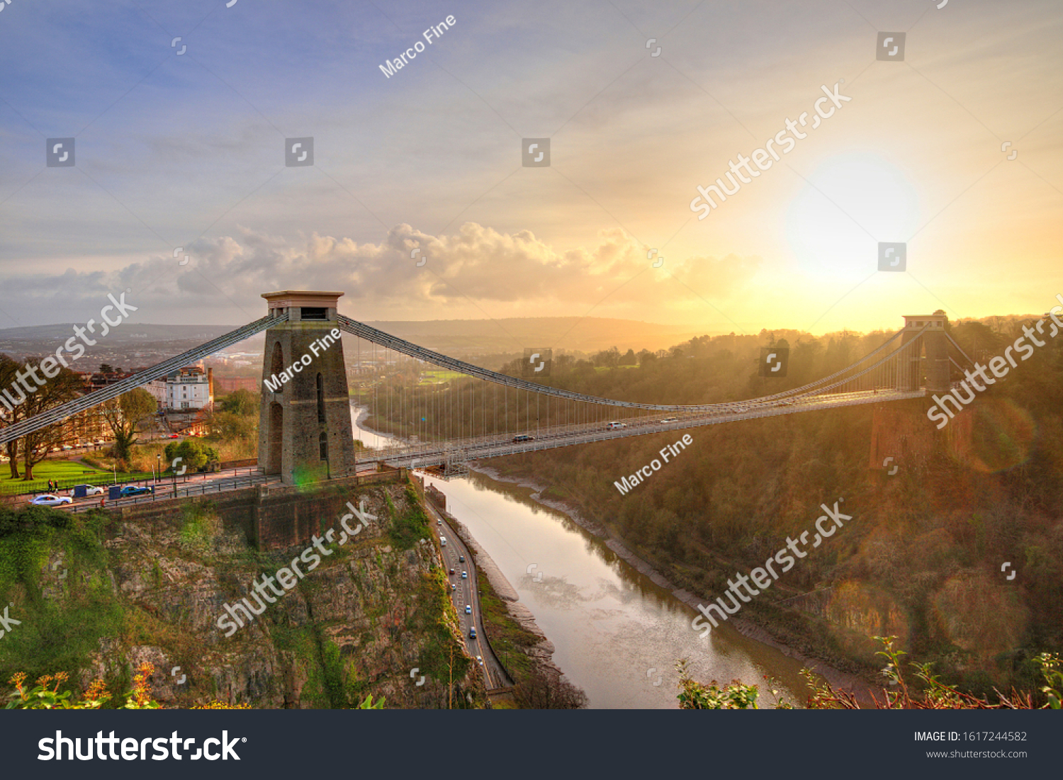 View in a winter sunset of the Clifton Suspension Bridge, a suspension bridge spanning the Avon Gorge and the River Avon in the city of Bristol, UK #1617244582