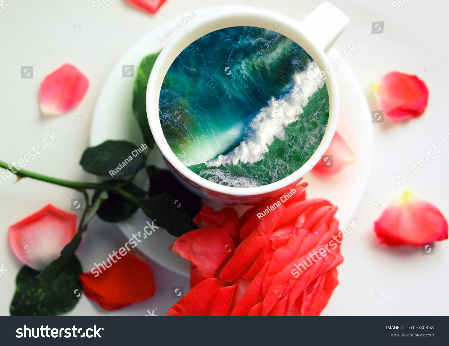 White cup with water. Sea. Ocean. Sea waves. Creative postcard. #1617580468