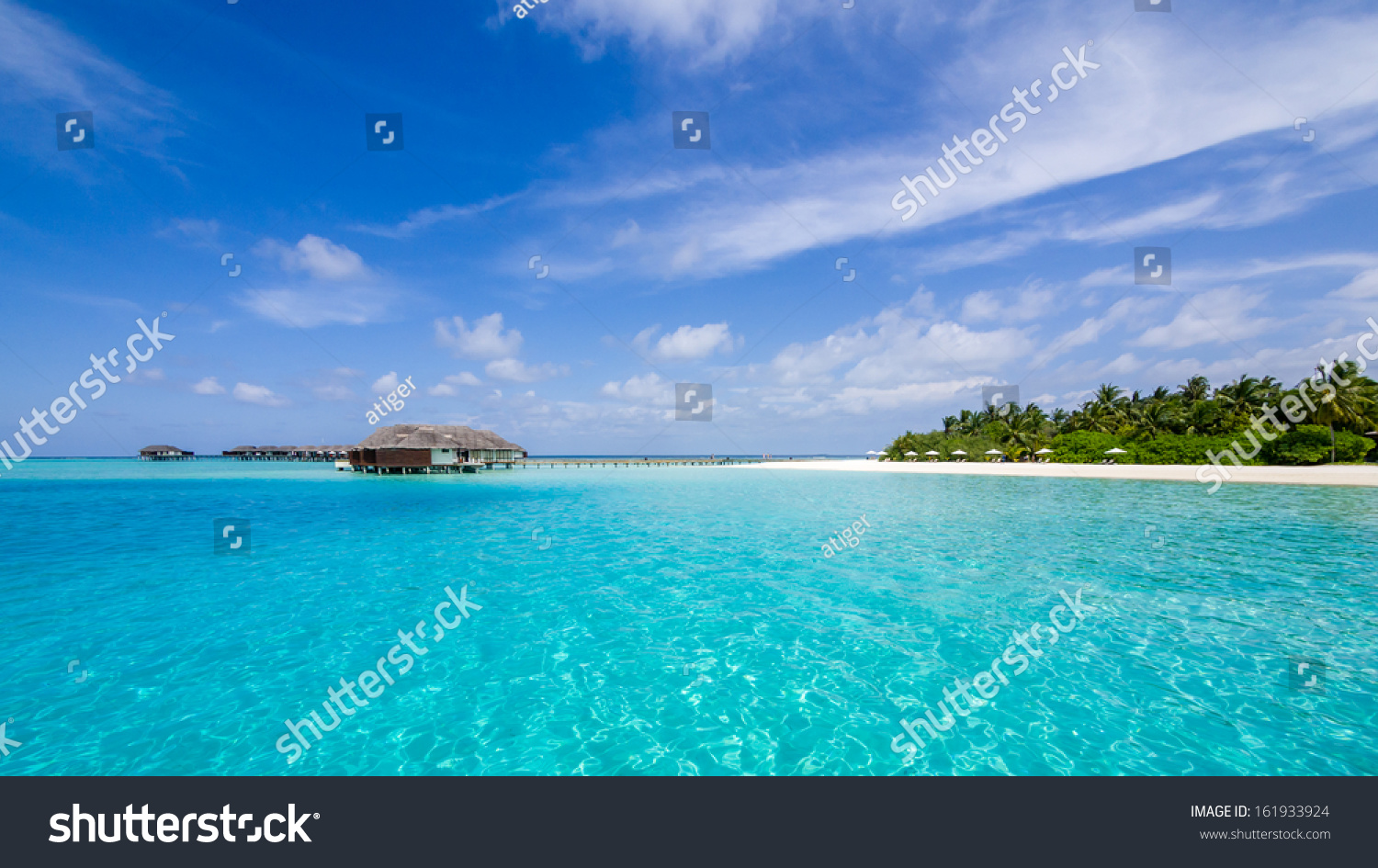 Happy days in Maldives, islands with vivid clear sea water, pretty endless beach, soft white sands,  luxury water villa, straight coconut trees, wonderful sunset and sun rise, blue sky with clouds. #161933924