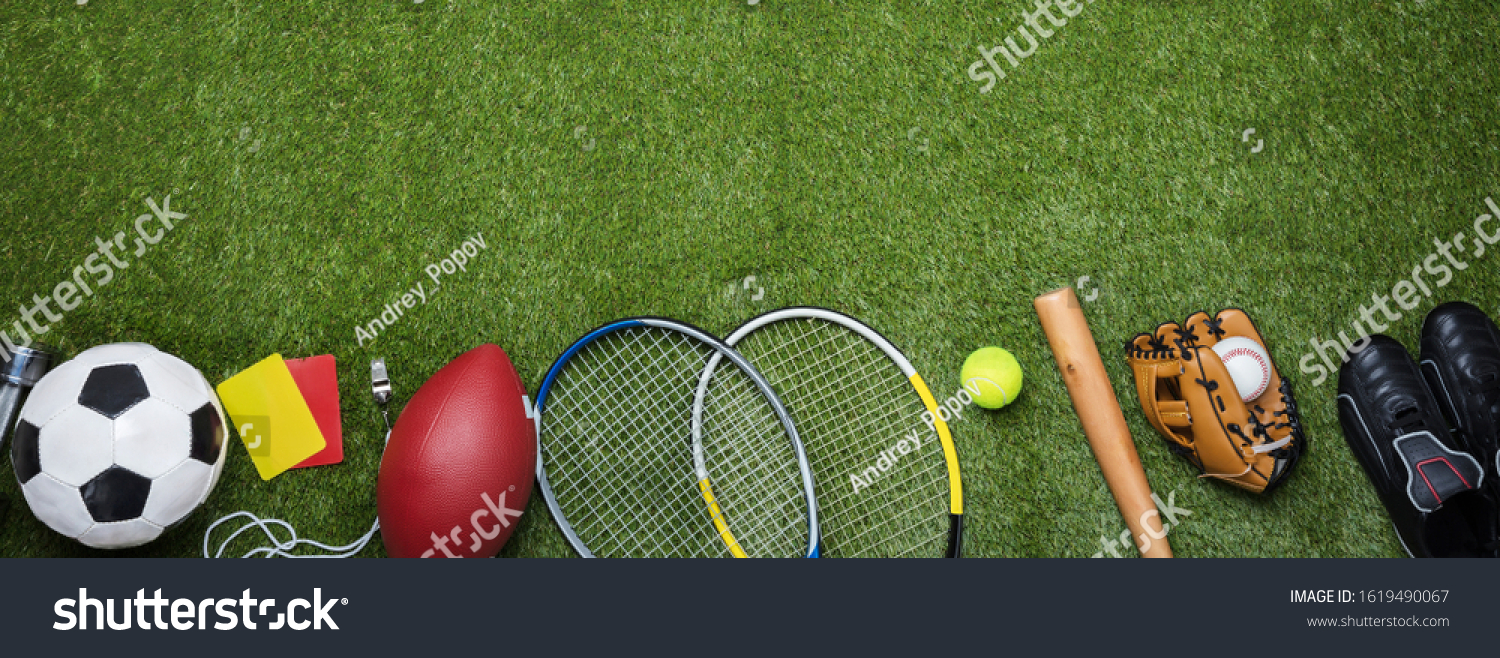 High Angle View Of Various Sport Equipment On Green Grass #1619490067