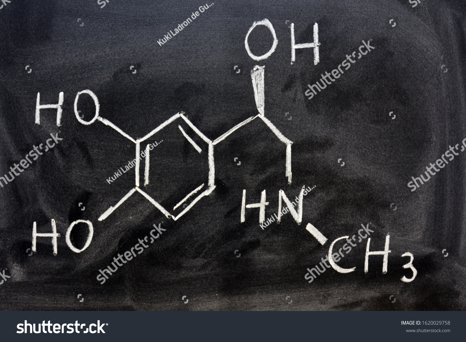 
Structural formula of adrenaline written by hand with a chalk on the blackboard #1620029758