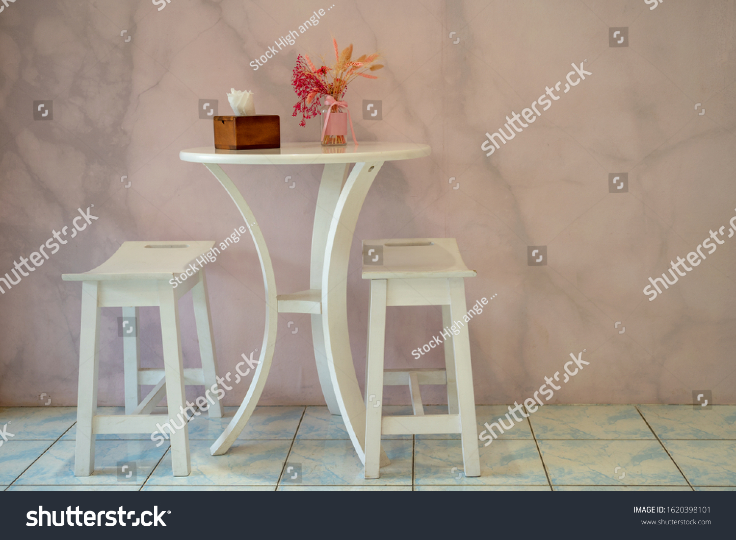Two white wooden chairs with table and flower in vase modern interior with modern wall background #1620398101