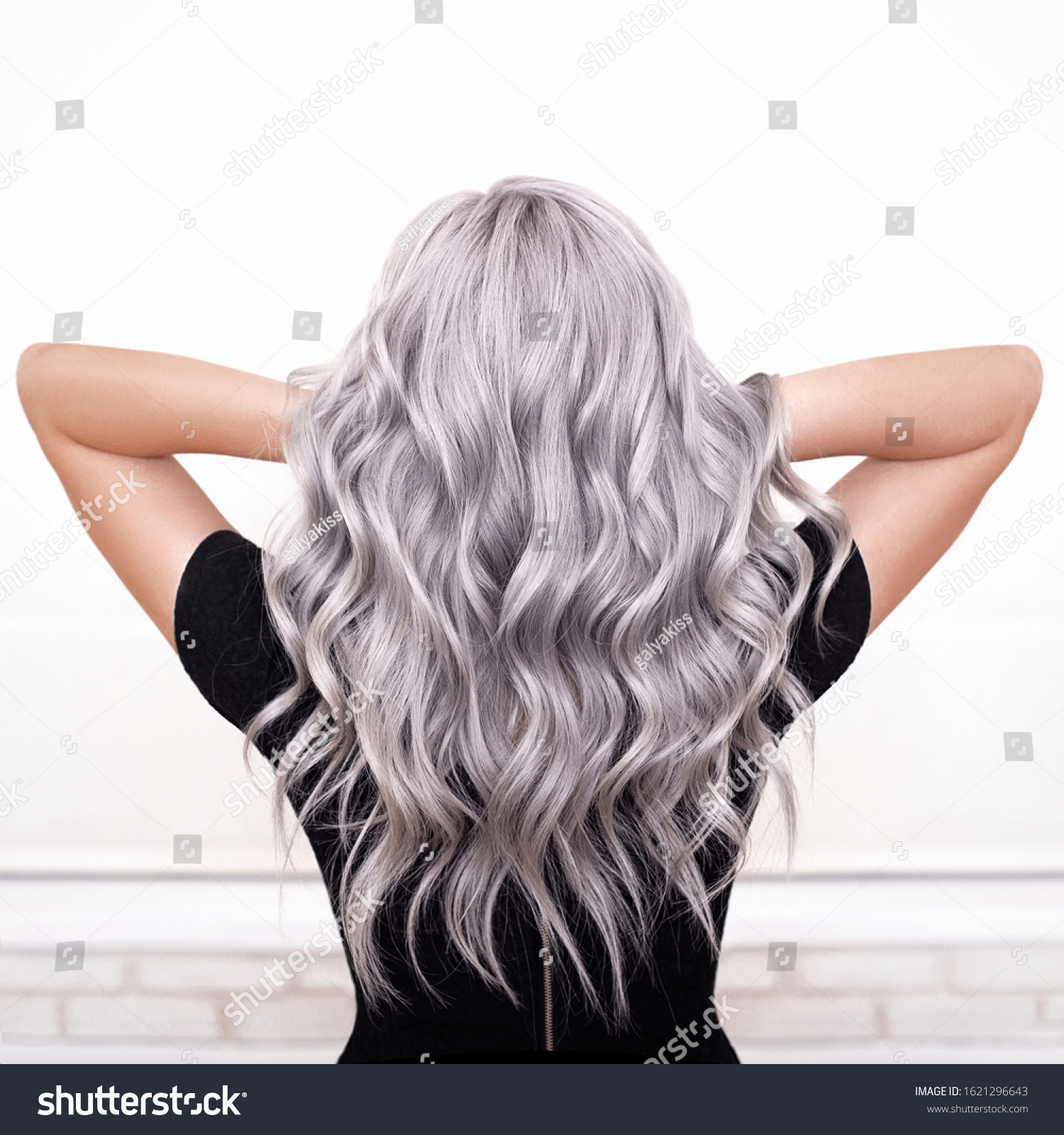 beautiful girl back with grey silver ash blonde wavy hair isolated #1621296643
