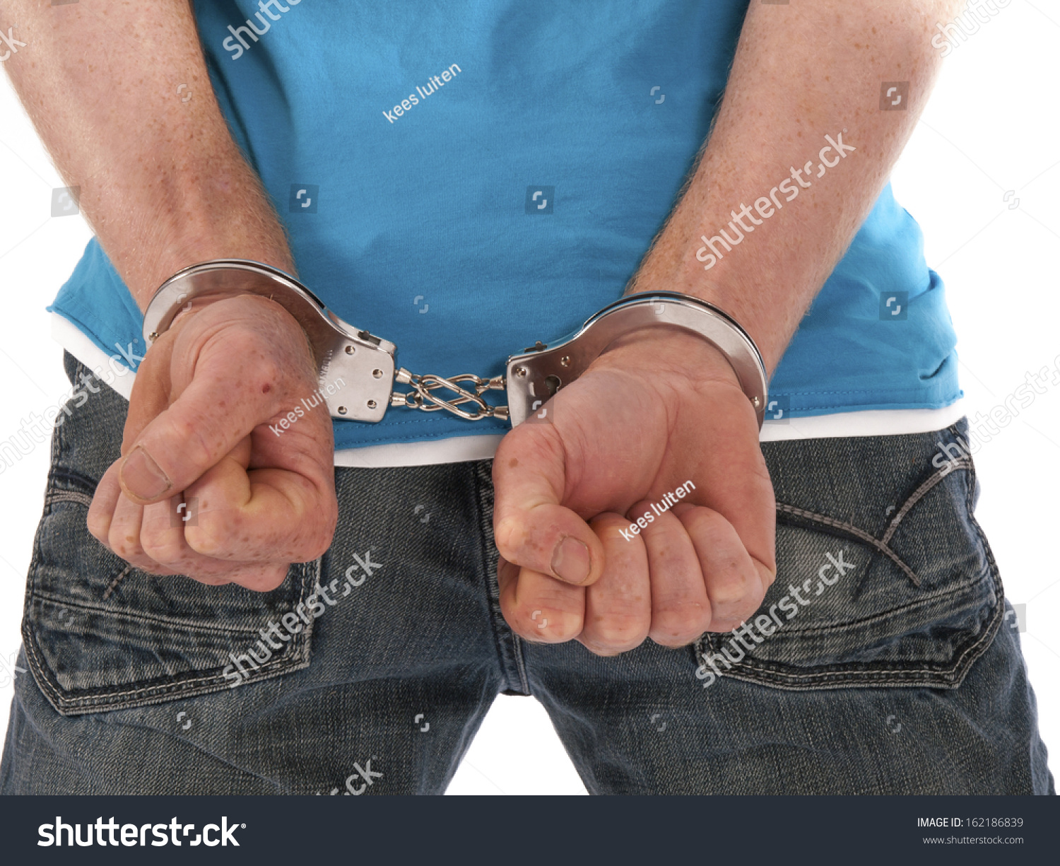 man with handcuffs on his back #162186839