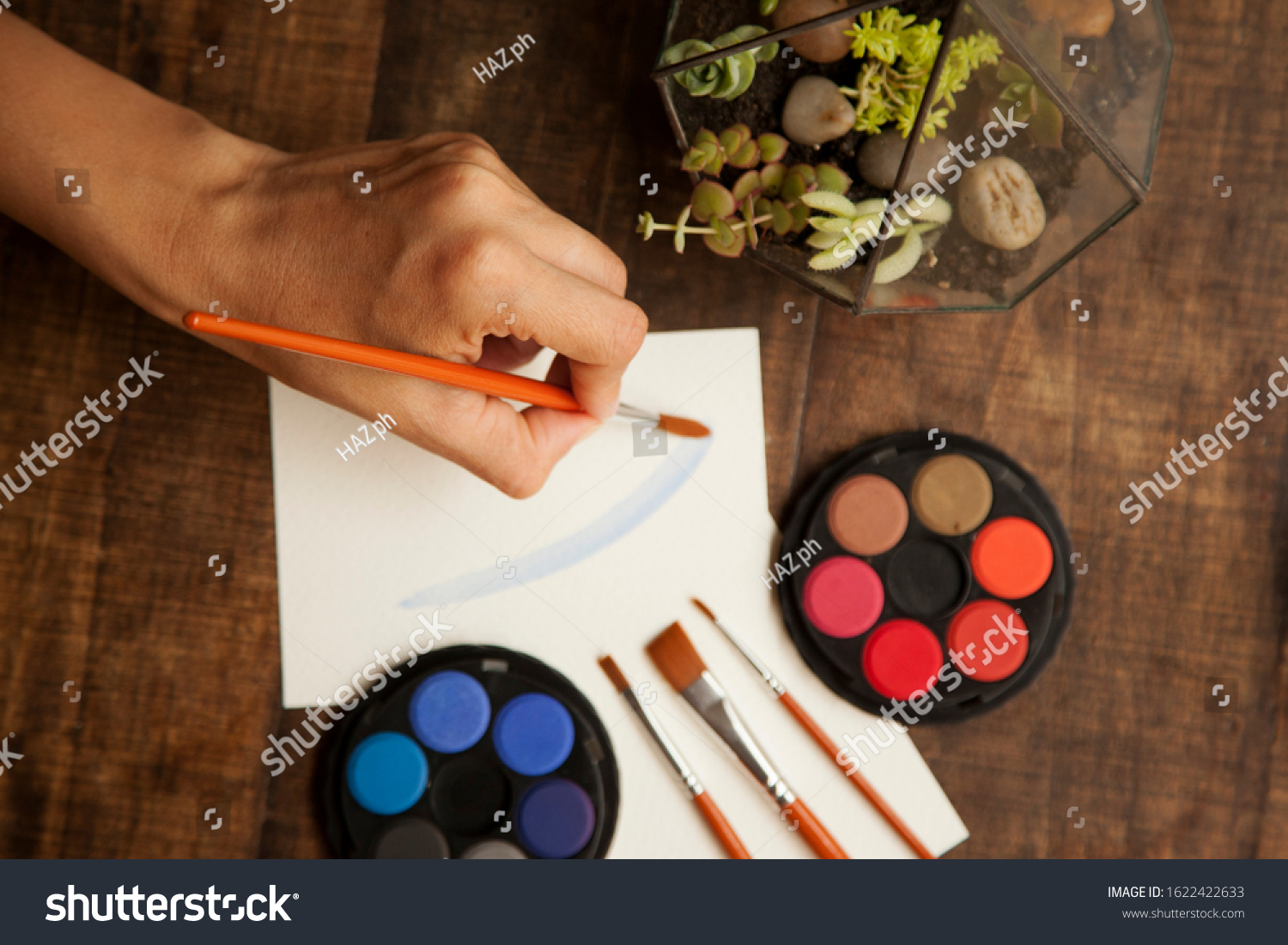 blank sheet on the table with paintbrushes and watercolor #1622422633
