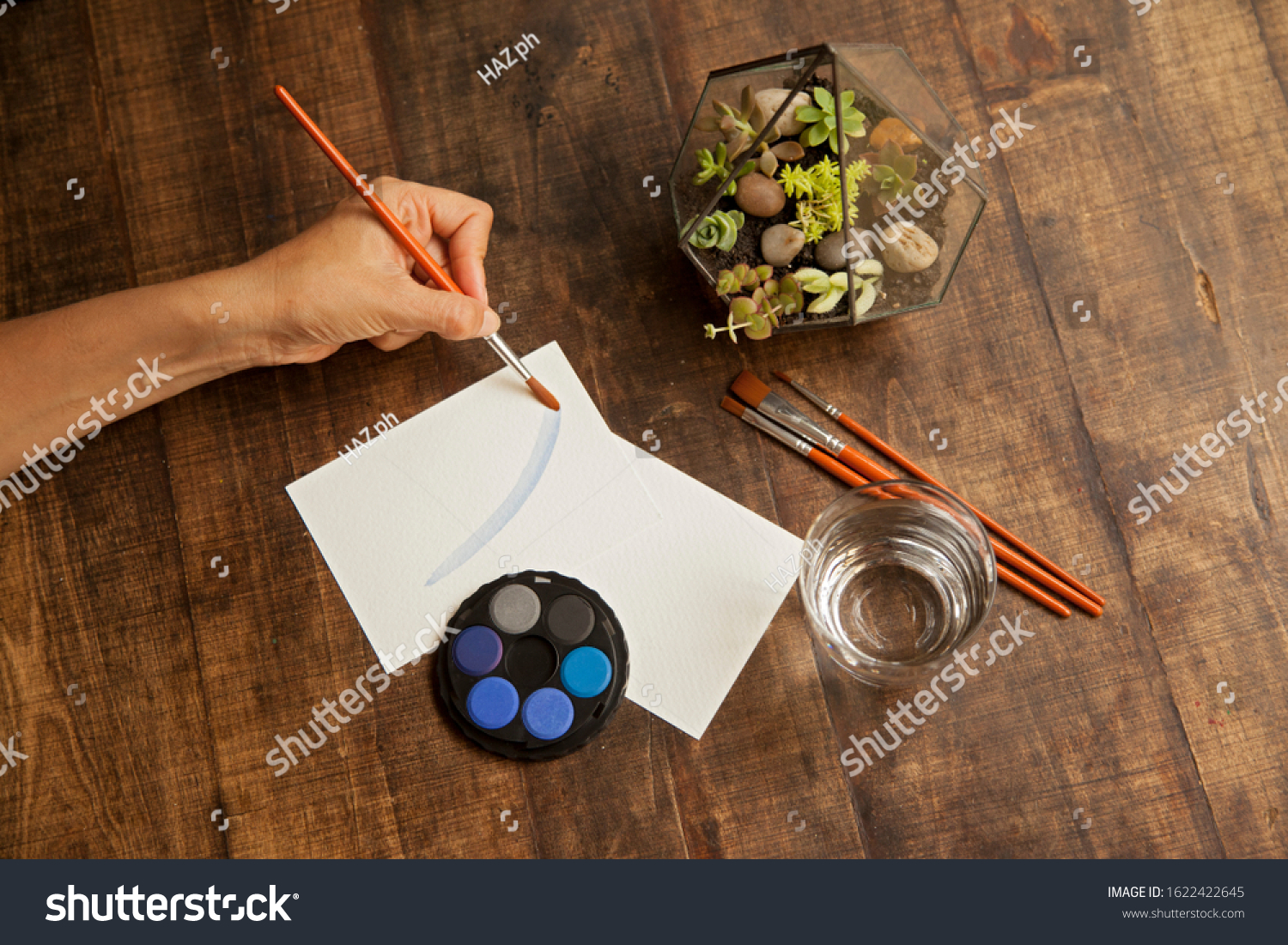 blank sheet on the table with paintbrushes and watercolor #1622422645