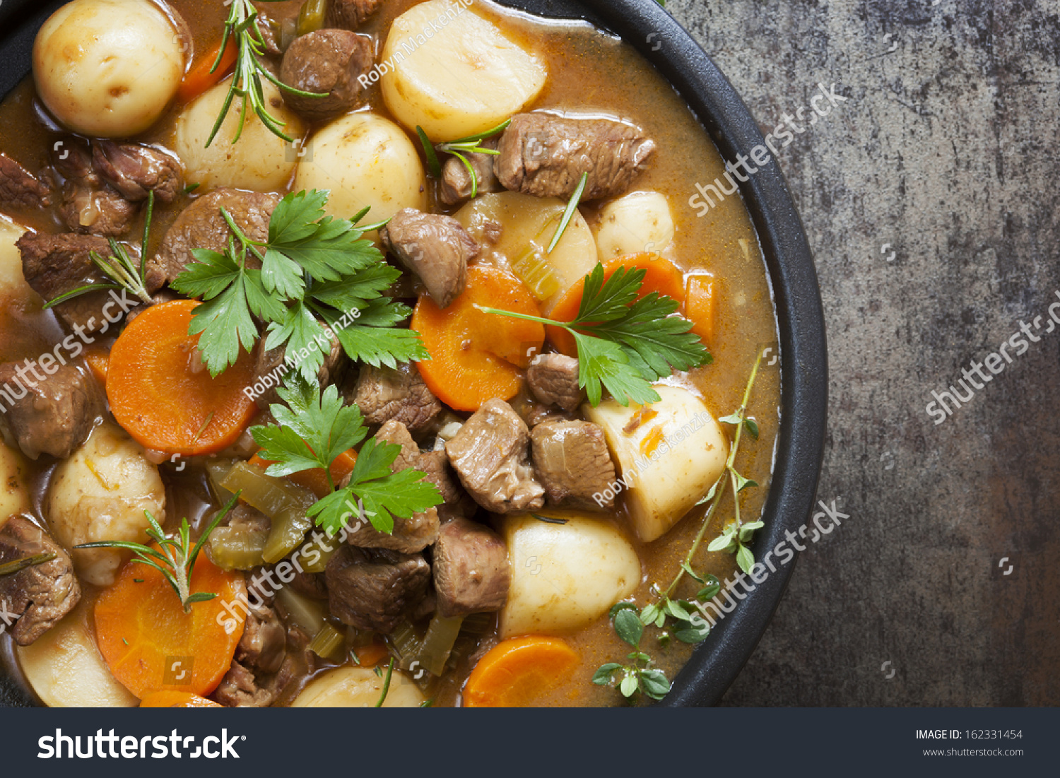 Irish stew, made with lamb, stout, potatoes, carrots and herbs. #162331454