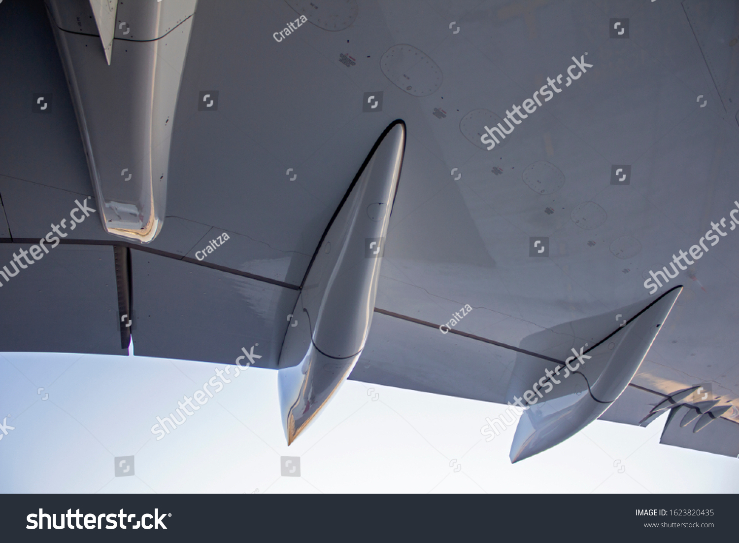 Early Morning Shot OF Flaps And Ailerons On A Large Commercial Airplane Wing #1623820435