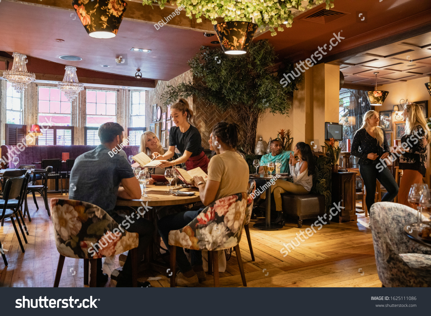 A wide shot of people dining at a restaurant in Newcastle-upon-Tyne. #1625111086