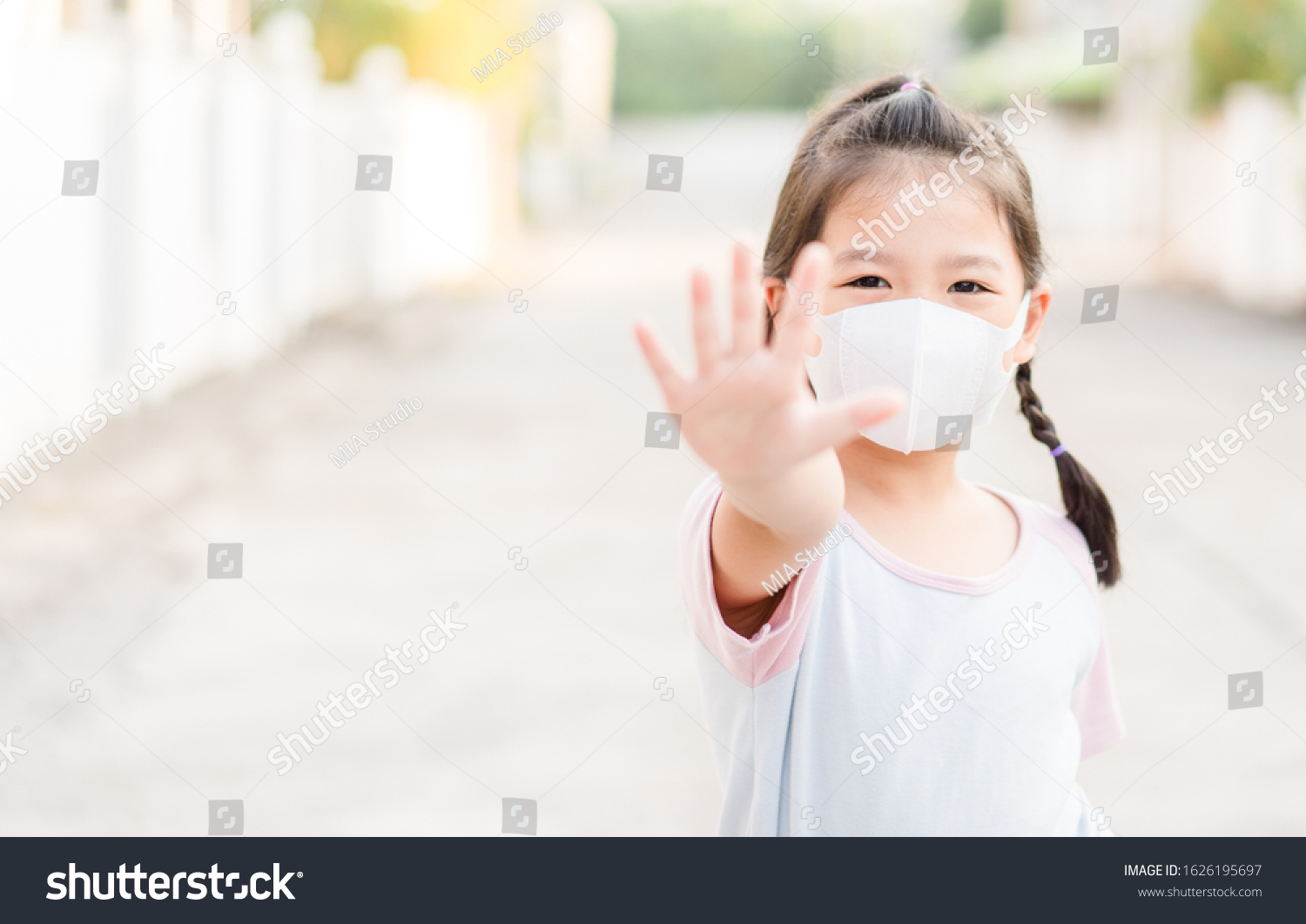 Coronavirus Covid-19.Stay at home Stay safe concept.Little chinese girl wearing mask for protect.show stop hands gesture for stop corona virus outbreak.Coronavirus.monkeypox virus.kid child girl stop. #1626195697