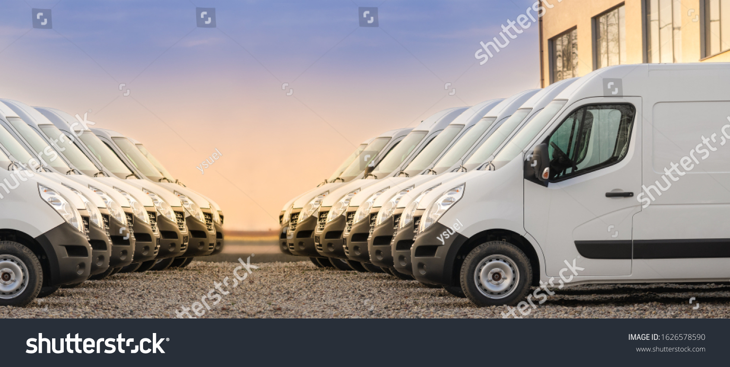 commercial delivery vans parked in two rows. Transporting service company. #1626578590