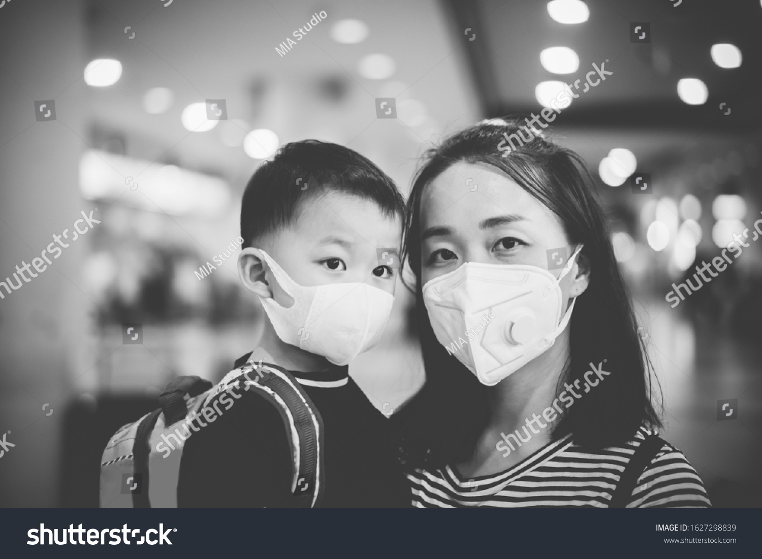 Coronavirus covid-19.Asian tourism kid toddler boy with mother mask for protect coronavirus back to school.vaccinated family at airport.Digital health passport certificate for travel during covid19. #1627298839