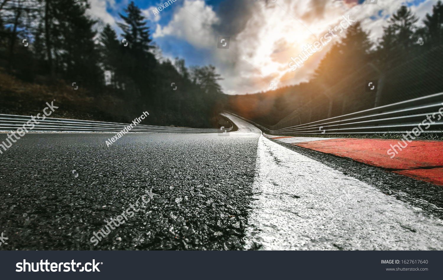 Race Car / motorcycle racetrack after rain on a cloudy day #1627617640