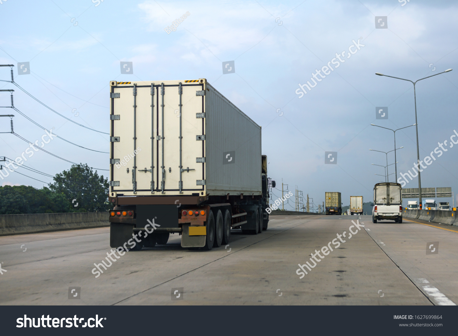 White Truck driving on highway road with  container, transportation concept.,import,export logistic industrial Transporting Land transport on the asphalt expressway #1627699864