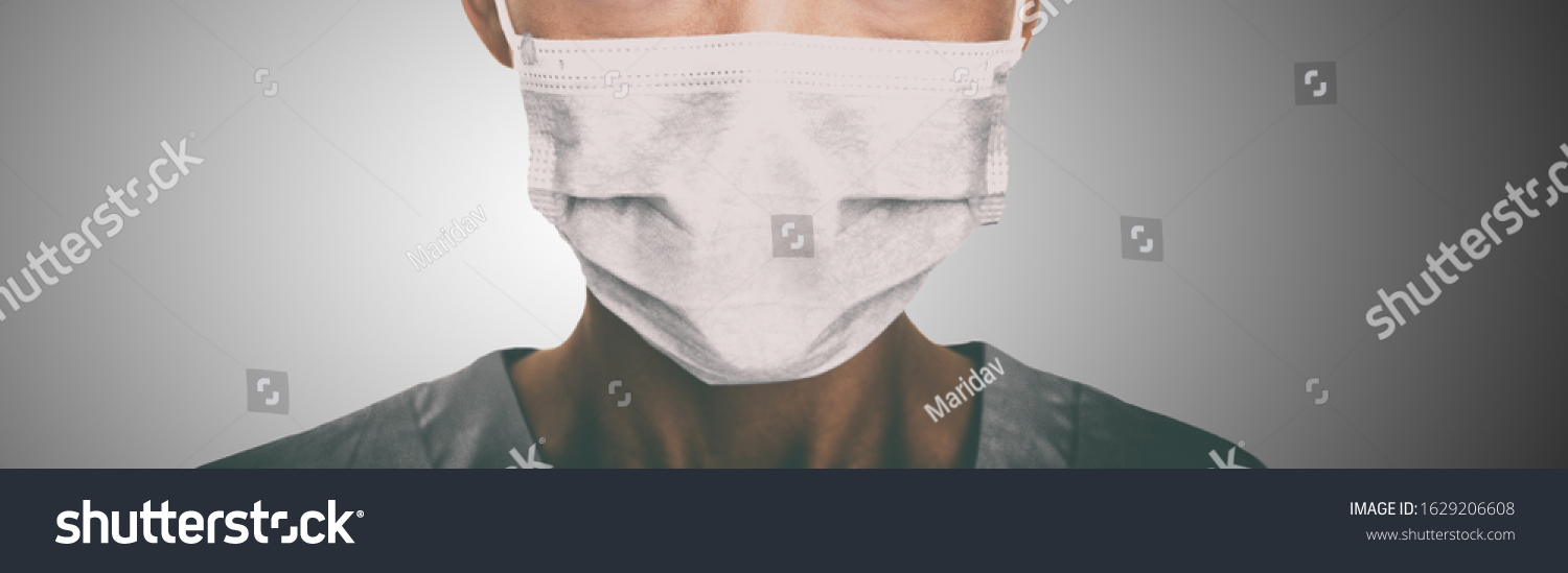 Doctor wearing protection face mask against coronavirus. Banner panorama medical staff preventive gear. #1629206608